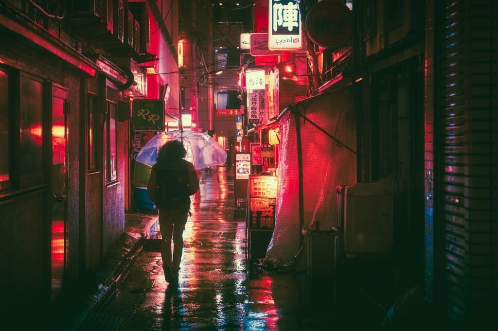 A woman walks alone in a dark city at night, surrounded by neon signs