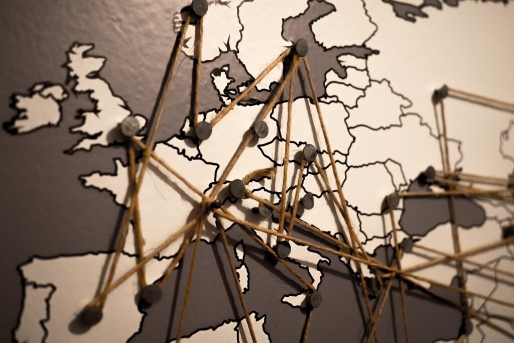 A map with strings and pins indicating a complex travel plan