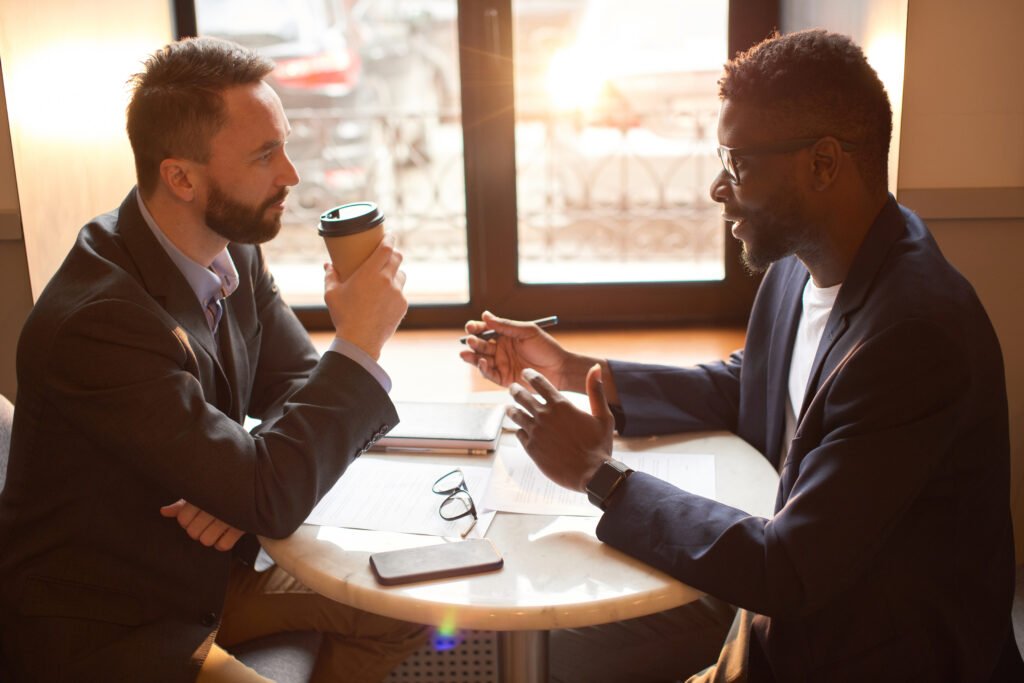 Two men discuss and plan to better understand each other